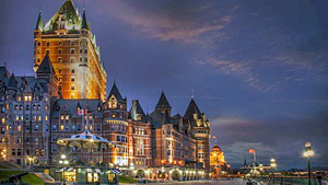 Disney Cruise Line NY Sailings Canada Cruises - A brickwork hotel surrounded by streetlights and a Canadian flag