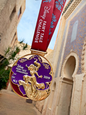 Grant your wishes and race into a whole new world during the Disney Fairy Tale Challenge! Participants completing both the Disney Princess Enchanted 10K and Half Marathon can look forward to earning this shining, shimmering medal celebrating Princess Jasmine from Disneys Aladdin.