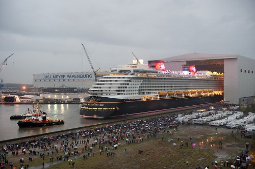 The Disney Dream cruise ship makes its first public appearance Oct. 30, 2010 in Papenburg, Germany as it begins to exit an enclosed building dock, pulled by a tugboat, at the Meyer Werft shipyard. Thousands of local residents gathered to see the "float out" ceremony. The new ship is scheduled to sail its maiden voyage Jan. 26, 2011 from Port Canaveral, Fla.